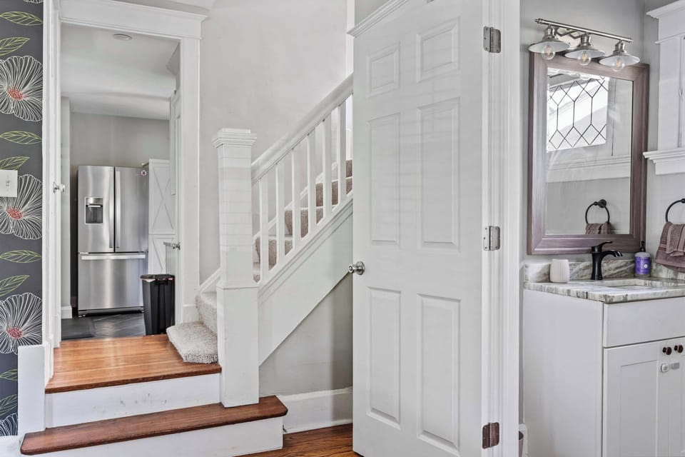 Entryway w/ stairs, wood floors & bright welcoming feel