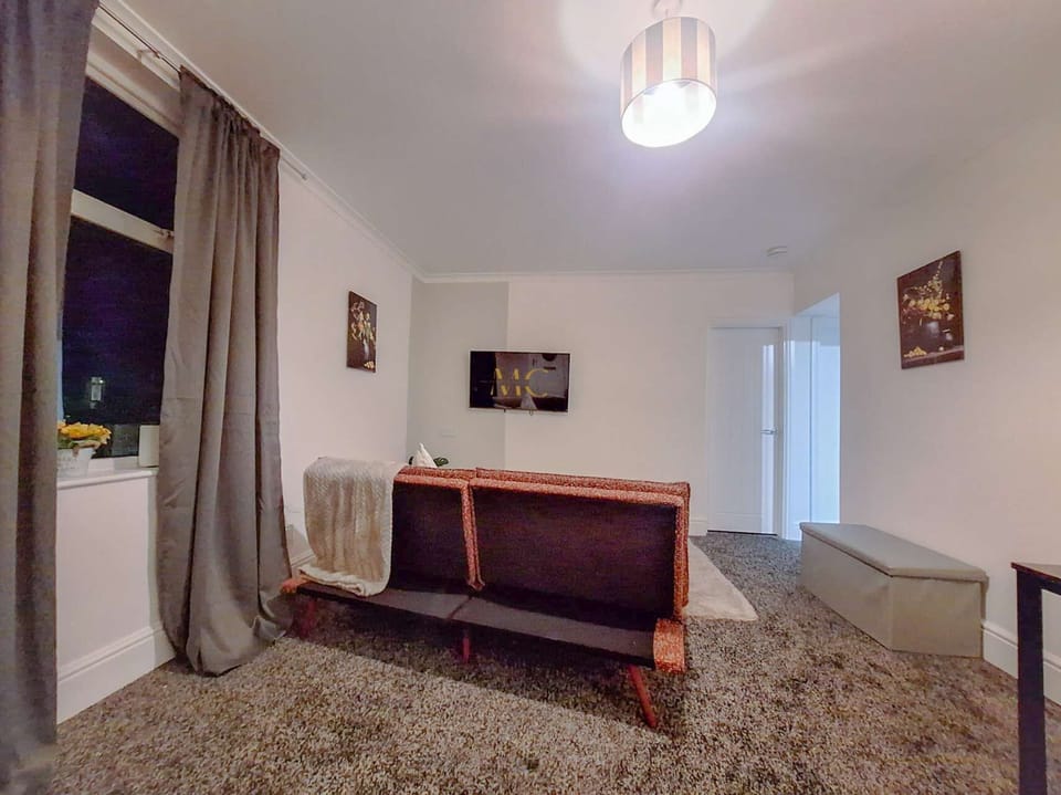 Lounge area offering a cosy space to relax, with comfortable seating and a warm, homely atmosphere.