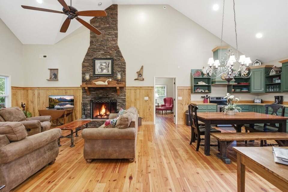 Living Room | Stone Fireplace | Open Layout & Dining Area