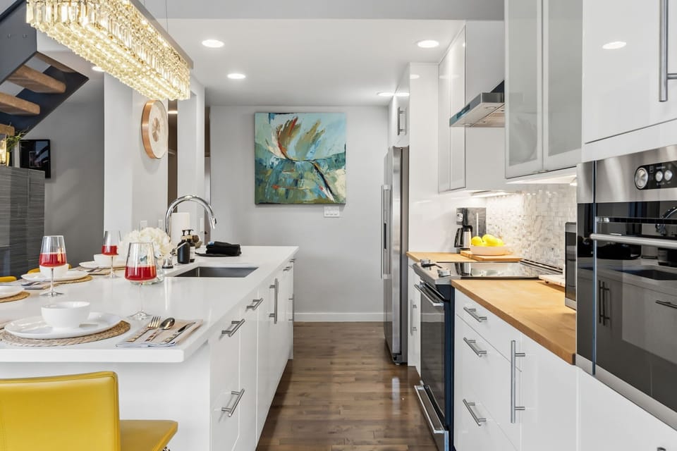 Updated kitchen with stainless steel appliances and everything needed to cook a meal at the home after a day in the mountains.
