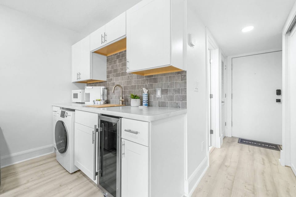 Bright, functional kitchen space with direct access to entry and hallway