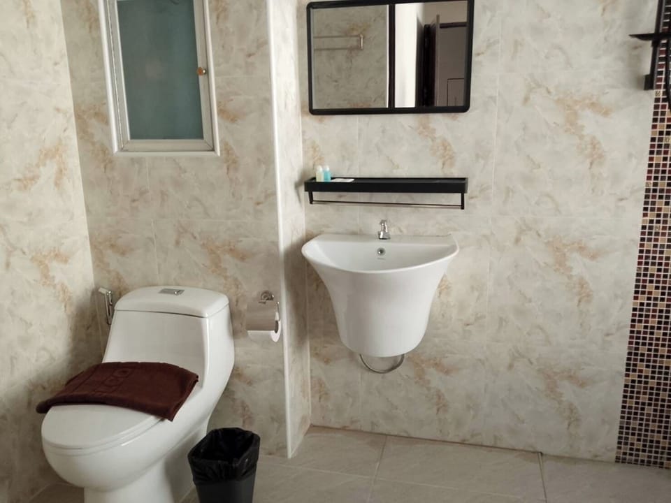 Deluxe Quadruple Room, Balcony | Bathroom | Shower, hair dryer, bidet, towels