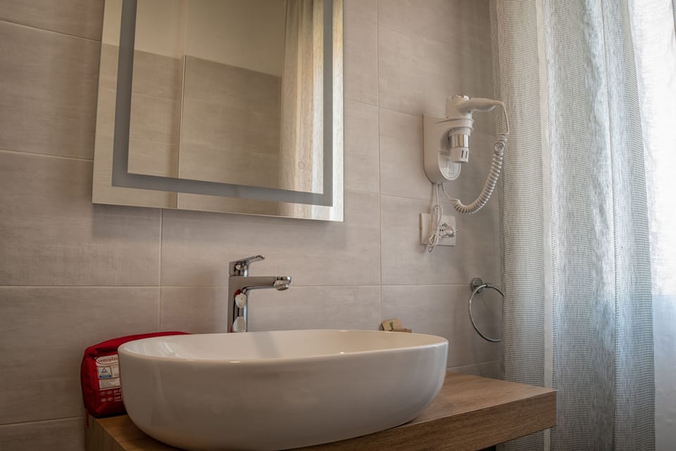 Comfort Room | Bathroom | Shower, hair dryer, bathrobes, slippers