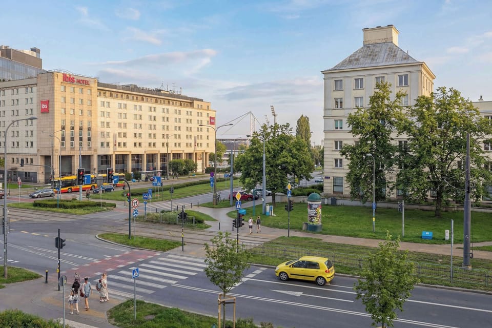 View of historic buildings and lively city surroundings.