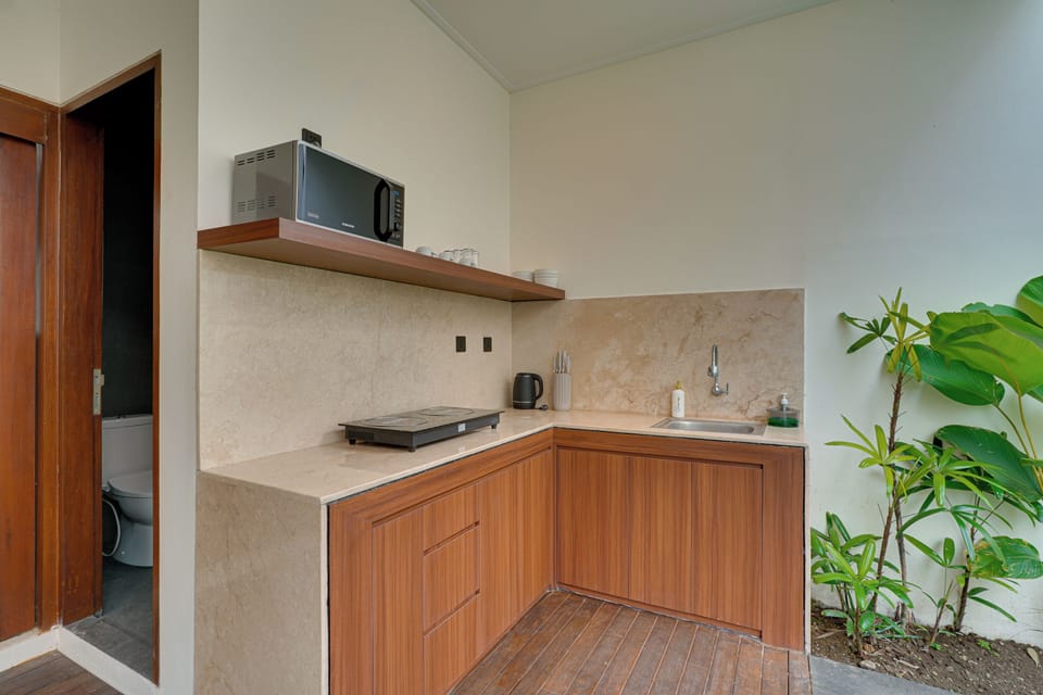 Villa, Balcony, Pool View | Private kitchen | Electric kettle, dining tables