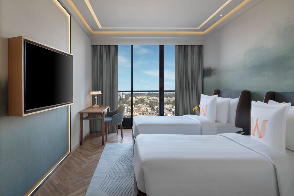 Premium bedding, memory foam beds, minibar, in-room safe