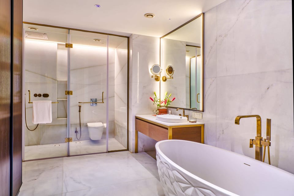 Suite, 1 King Bed | Bathroom | Shower, free toiletries, hair dryer, slippers