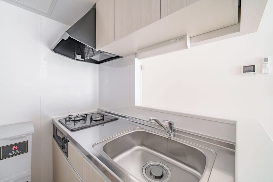 Apartment | Private kitchen | Fridge, microwave, stovetop, cookware/dishes/utensils