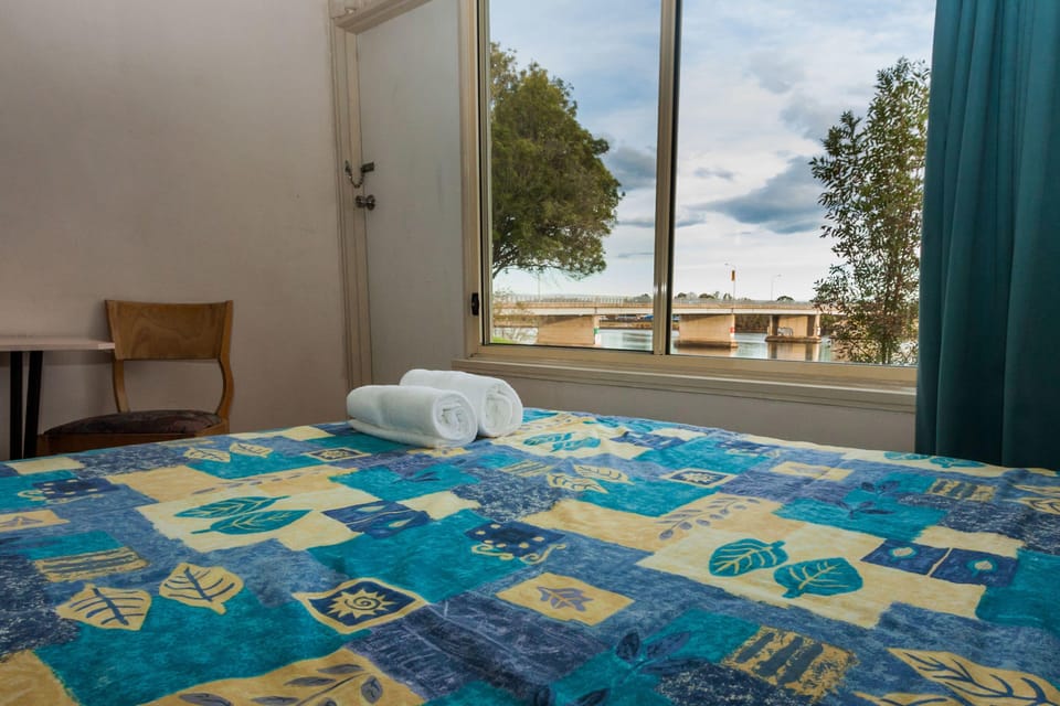 Riverfront Family Room | Desk, iron/ironing board (on request), WiFi (free), bed sheets