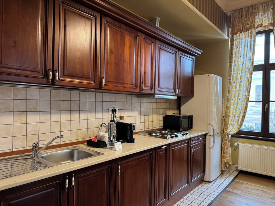 Premium Apartment | Private kitchen | Espresso maker, toaster, dining tables