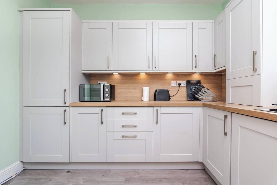 A clean and fully equipped kitchen ready for your culinary needs.