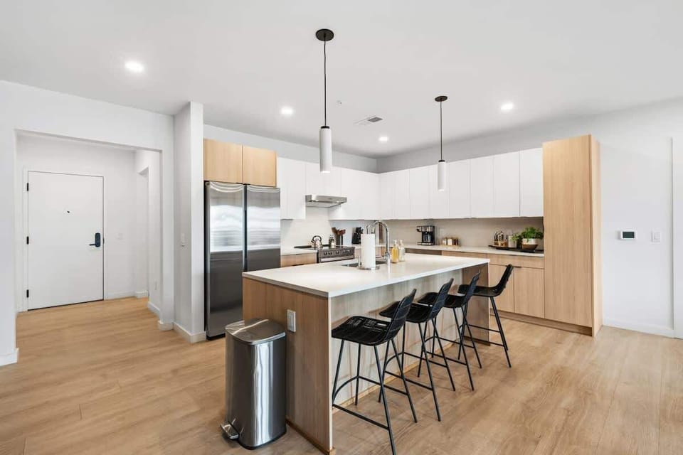 Large waterfall island with bar seating for casual morning coffee.