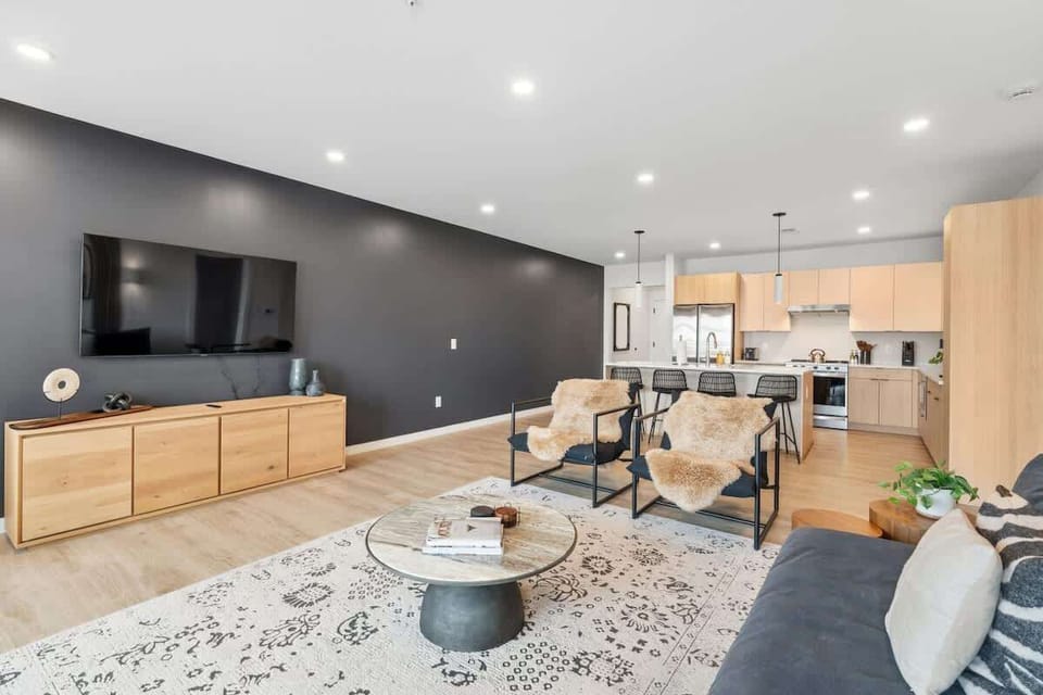 Large flat-screen TV and custom cabinetry for the ultimate movie night.