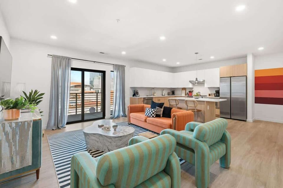 Living area with Smart TV and balcony access