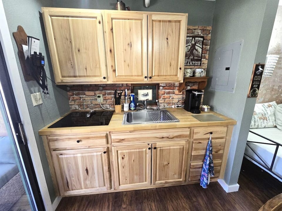 All your kitchen essentials including a stovetop, fridge, microwave, and coffee maker!