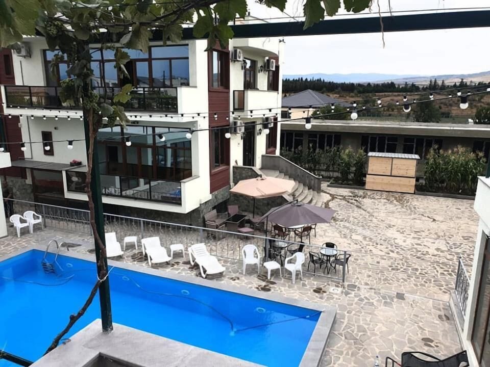 Seasonal outdoor pool, open 8:00 AM to 10:00 PM, pool umbrellas