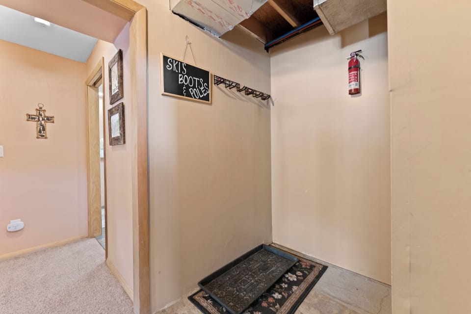 Your ski equipment finds its perfect home in this dedicated mudroom, complete with hanging storage for boots and poles after mountain adventures.
