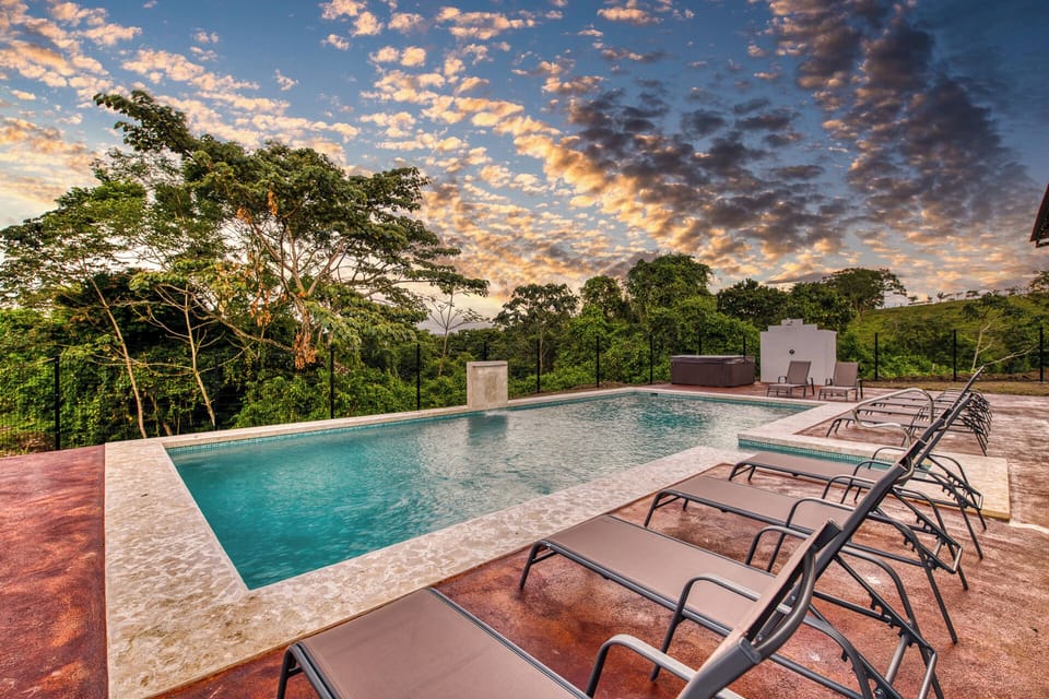 Poolside Paradise: Dive into relaxation with stunning views, lounge chairs, and a hot tub!