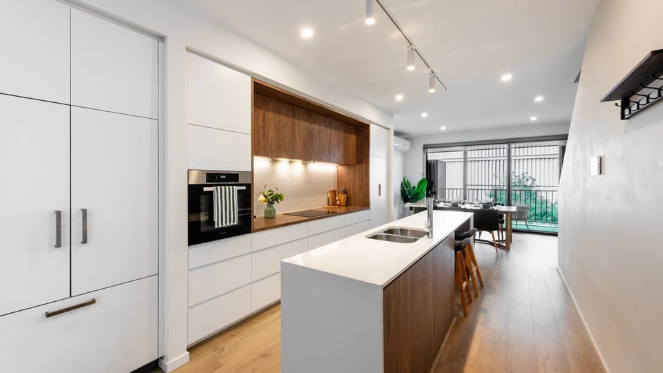 Modern chef’s kitchen with island bench and quality appliances.