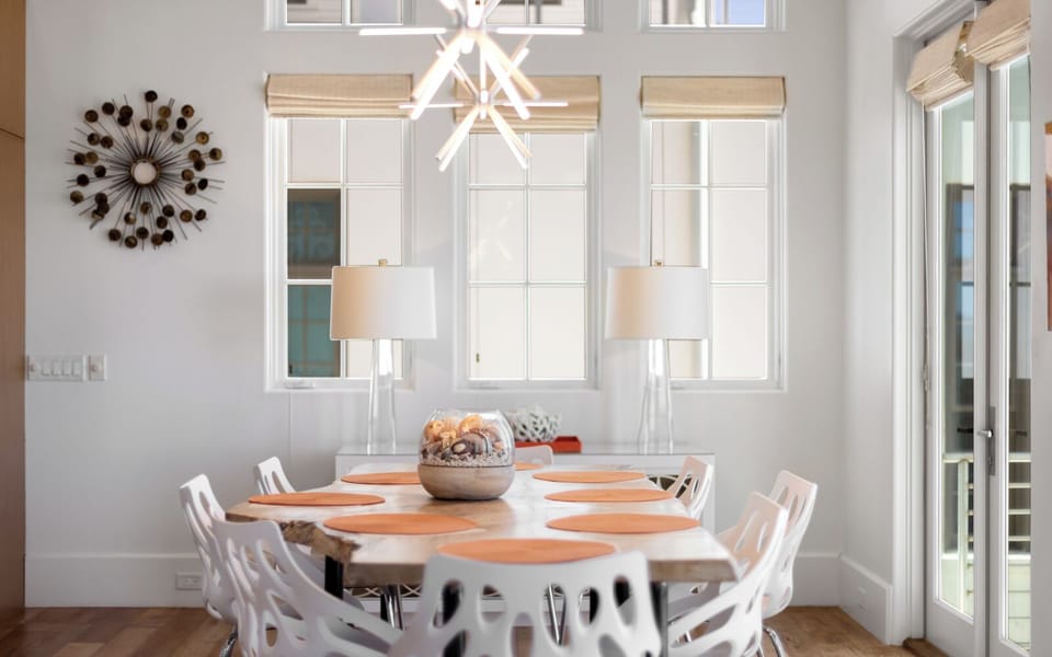 Your elegant dining space awaits with warm natural light, stylish furnishings, and a welcoming table perfect for memorable meals together.
