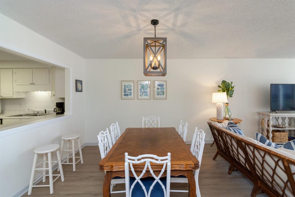 Gather around your elegant dining table while staying connected to the kitchen - perfect for memorable meals and conversations.