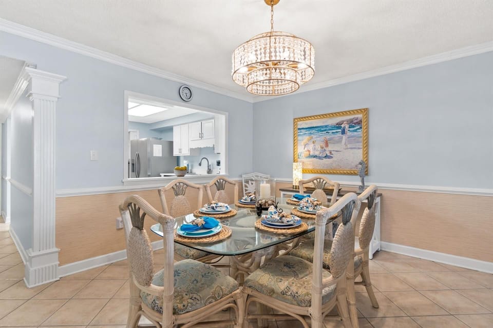 Gather around this elegant dining table where crystal chandeliers cast warm light over your memorable meals together.