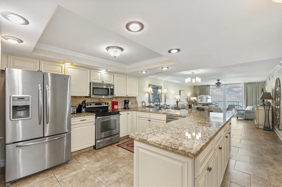 Your spacious kitchen features gleaming granite counters and stainless appliances, perfect for preparing meals during your stay.
