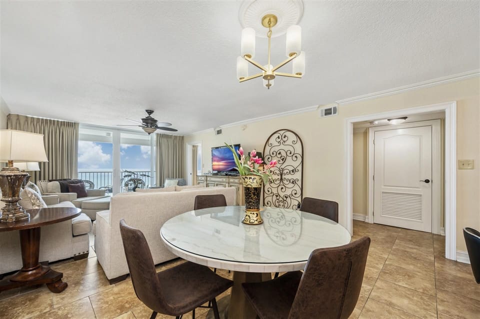 Your elegant dining area flows into the living space, perfect for memorable meals with breathtaking ocean views beyond.