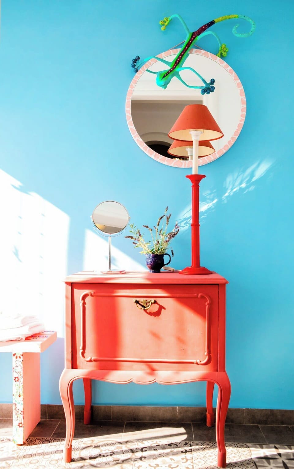 Vibrant Island Interior Detail with Coral Console and Turquoise Wall