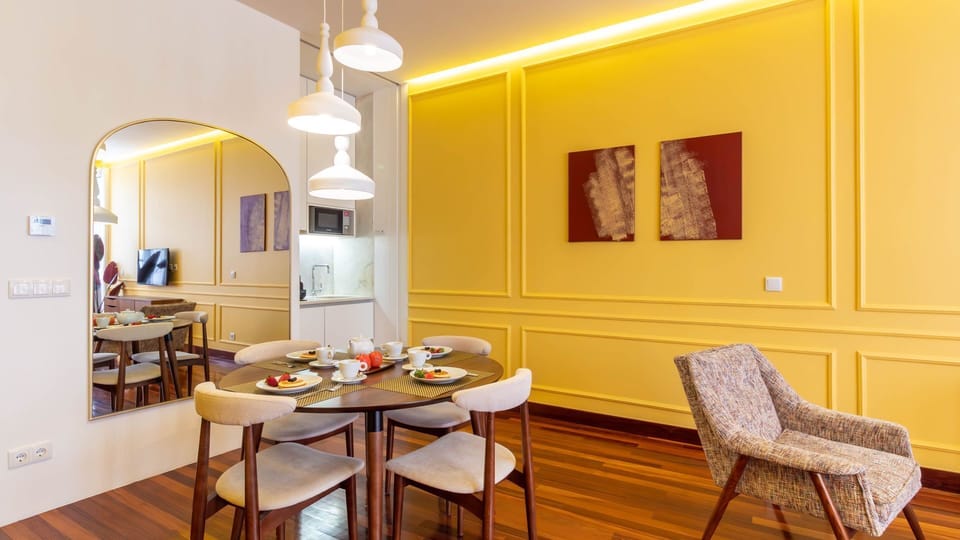 Elegant dining area with designer pendant lighting, a round table for four, and a sleek kitchenette for relaxed meals at home.
#PortoApartment #DiningInStyle #PortoStay #ModernInterior #PortoTravel #PortugalHomes #StylishStay
