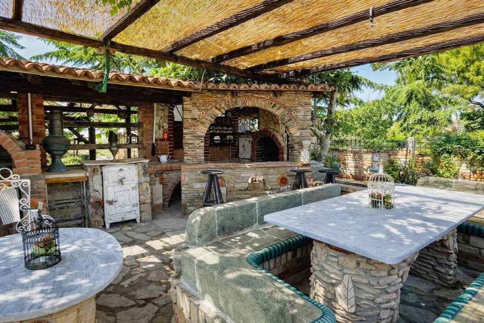 BBQ and shaded seating area — a great place to enjoy meals, relax in the shade, and spend time with family or friends.