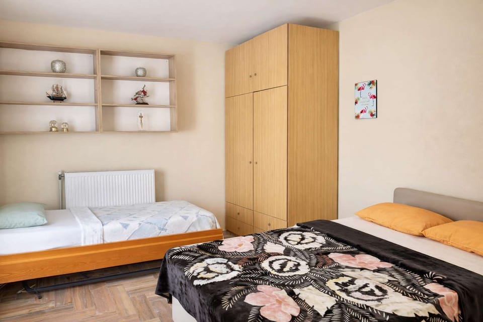 4th bedroom with double bed and additional single bed, and storage space, perfect for larger families or groups.