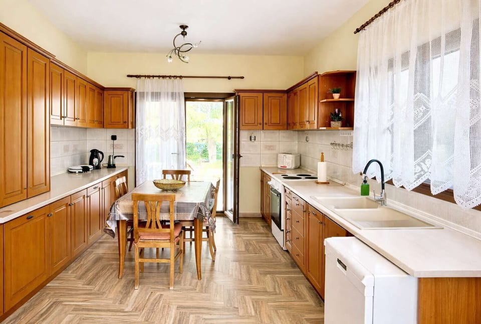 Fully equipped kitchen with modern appliances, plenty of counter space, and everything needed to prepare meals during your stay.