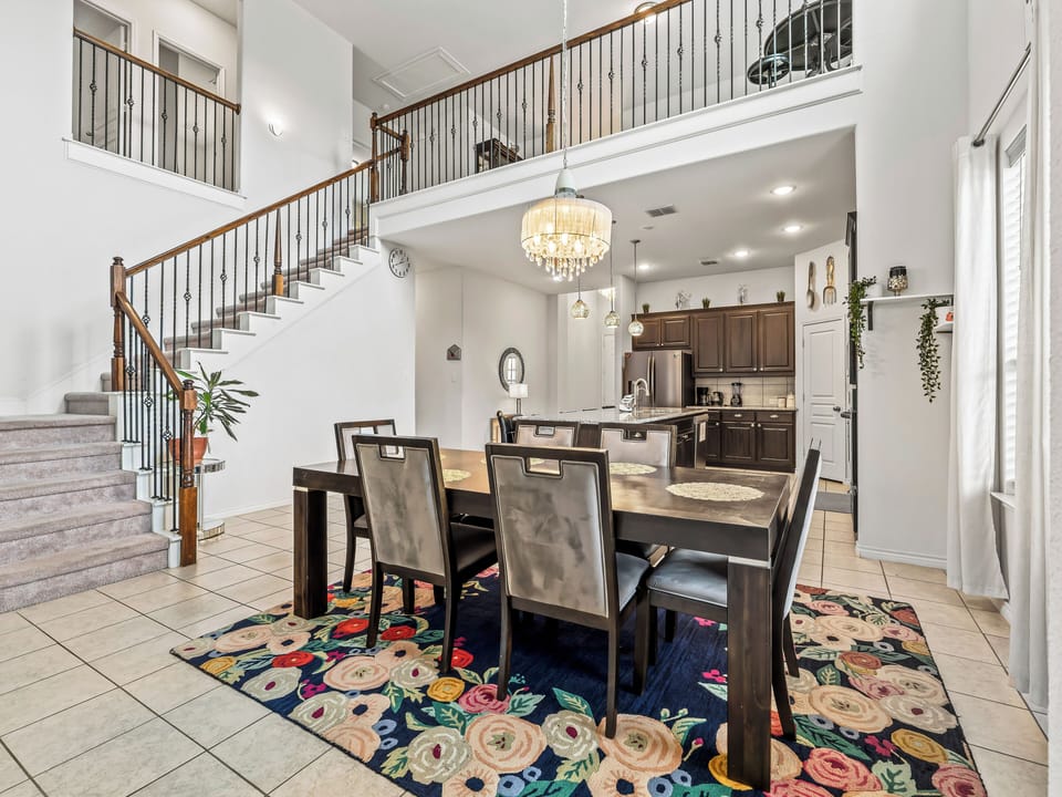 You'll love gathering around this elegant dining table while the open kitchen invites easy meal prep and conversation.