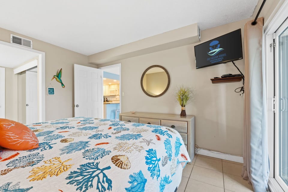 Bedroom - King Bed - Patio Access - Smart TV & Cable – Attached Full Bathroom – Linens Provided