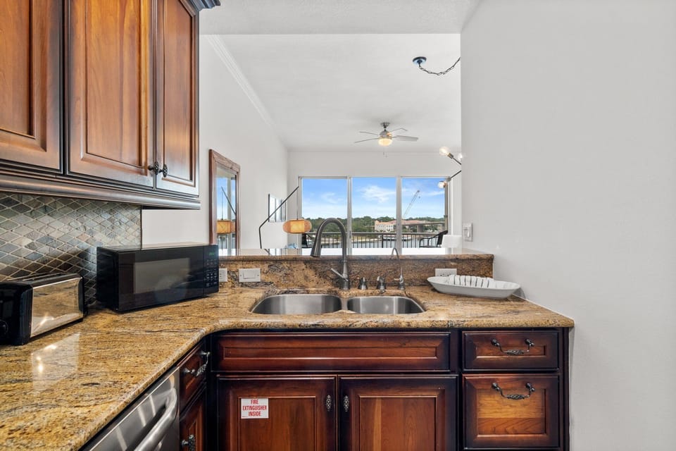 Modern kitchen with stainless steel appliances and a breakfast bar