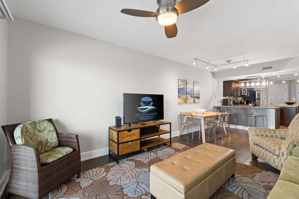 Spacious living room with cozy seating and a large flat-screen TV