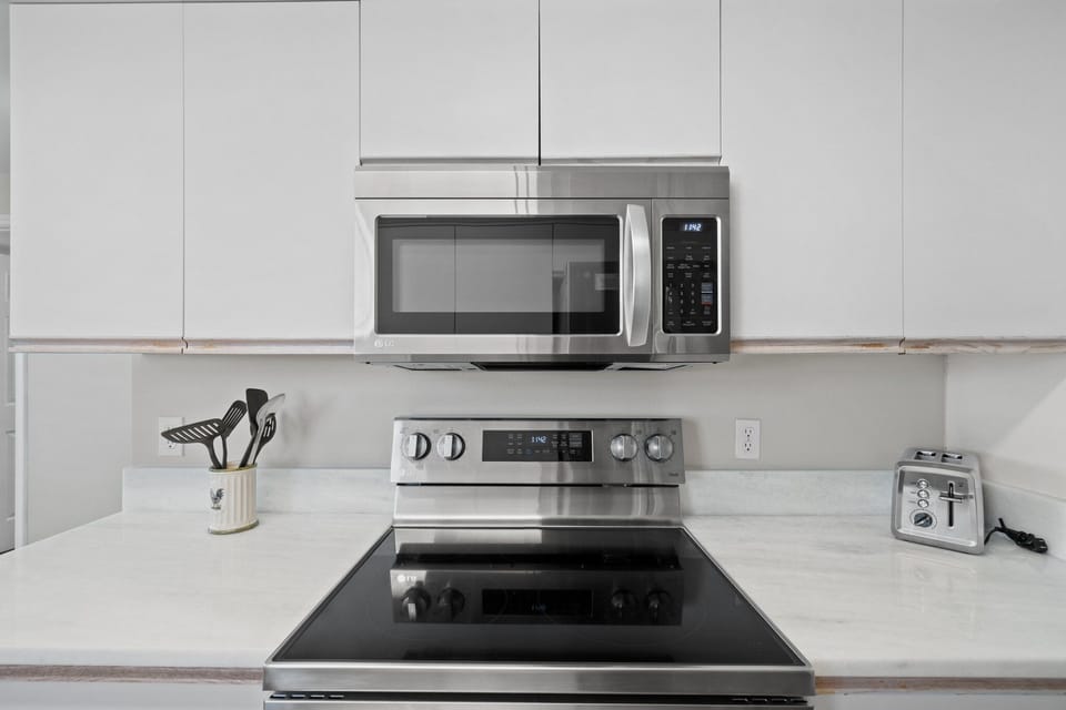 Fully equipped kitchen with sleek finishes and plenty of natural light