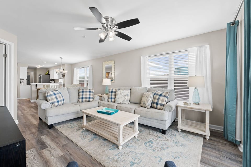 Bright and airy living room, offering plenty of natural light and an ocean view