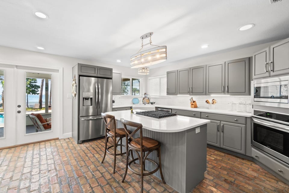 Fully equipped kitchen with modern finishes and an island for extra space