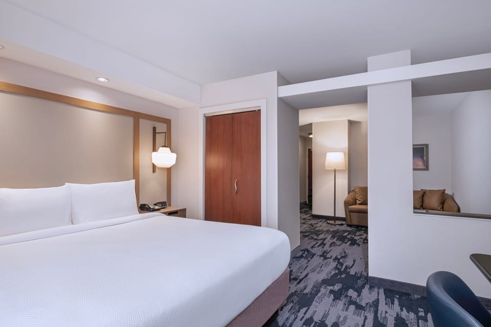 Premium bedding, desk, blackout drapes, iron/ironing board