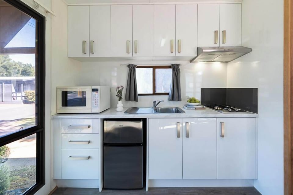 Standard Cabin (Sleeps 4) | Private kitchenette | Shared fridge, microwave, stovetop, toaster