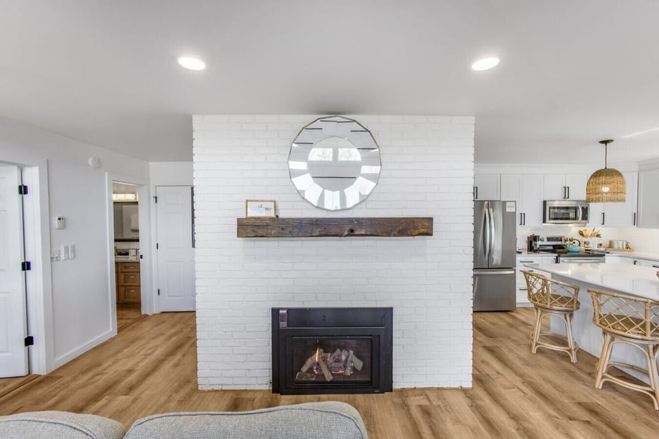 Enjoy cozy evenings by the fireplace after a day on the lake or the slopes