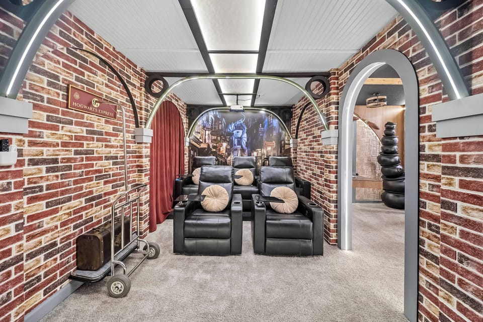 Step into this unique media room, where plush black recliners invite you to unwind. The striking brick walls contrast beautifully with the soft lighting, creating a cozy yet stylish atmosphere for movie nights or gatherings.