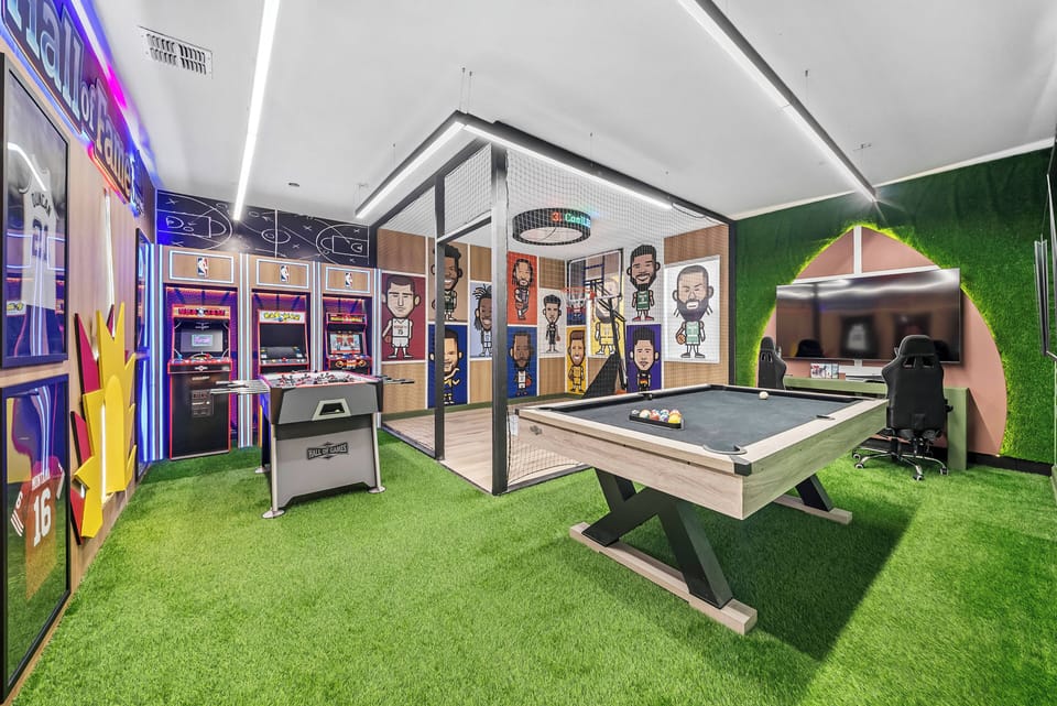 Enjoy our vibrant game room, featuring a stylish pool table and captivating artwork. With lively artificial grass flooring, it's the perfect spot for friendly competition and memorable gatherings with friends and family.