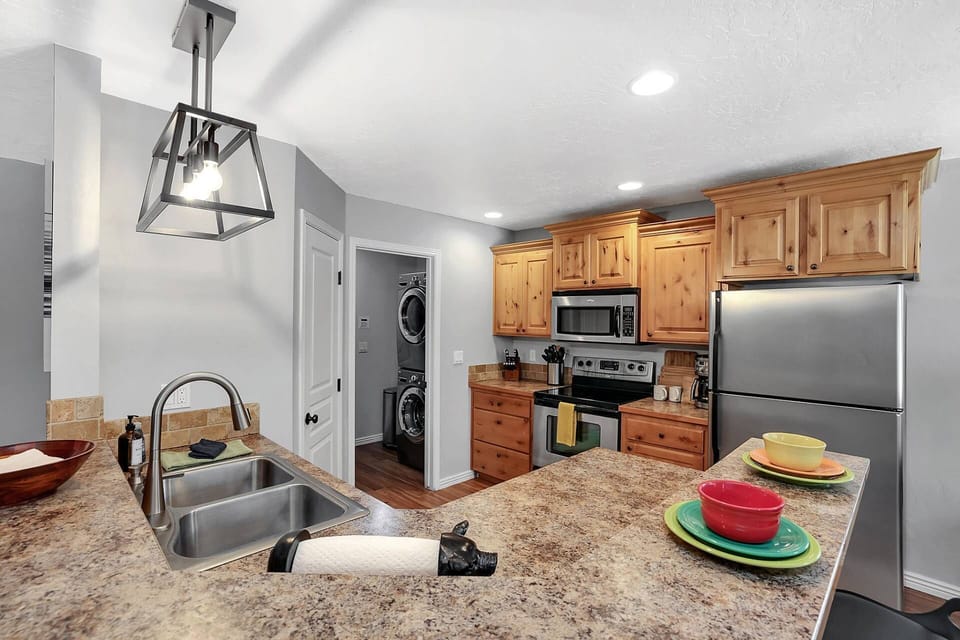 Fully-equipped kitchen with stainless appliances