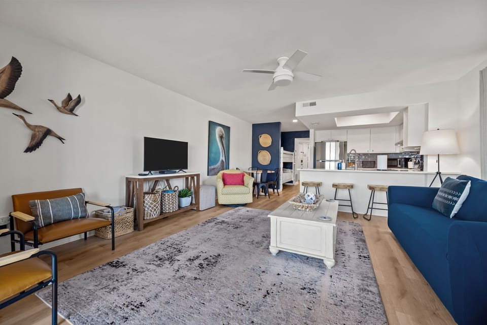 Inviting coastal lounge with modern comforts but keeping beach vibes