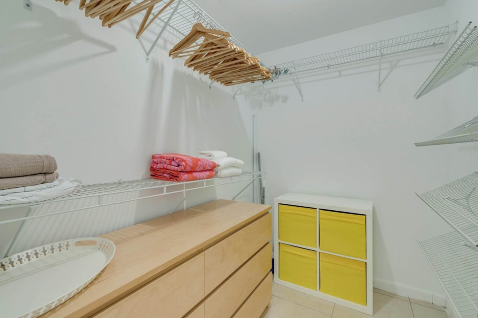 A spacious walk-in closet with plenty of room to organize your wardrobe and store your luggage during your stay