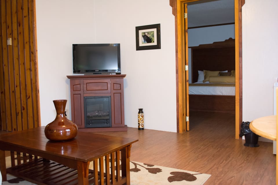 Suite, 1 King Bed with Sofa bed, Ocean View | Living area | Flat-screen TV