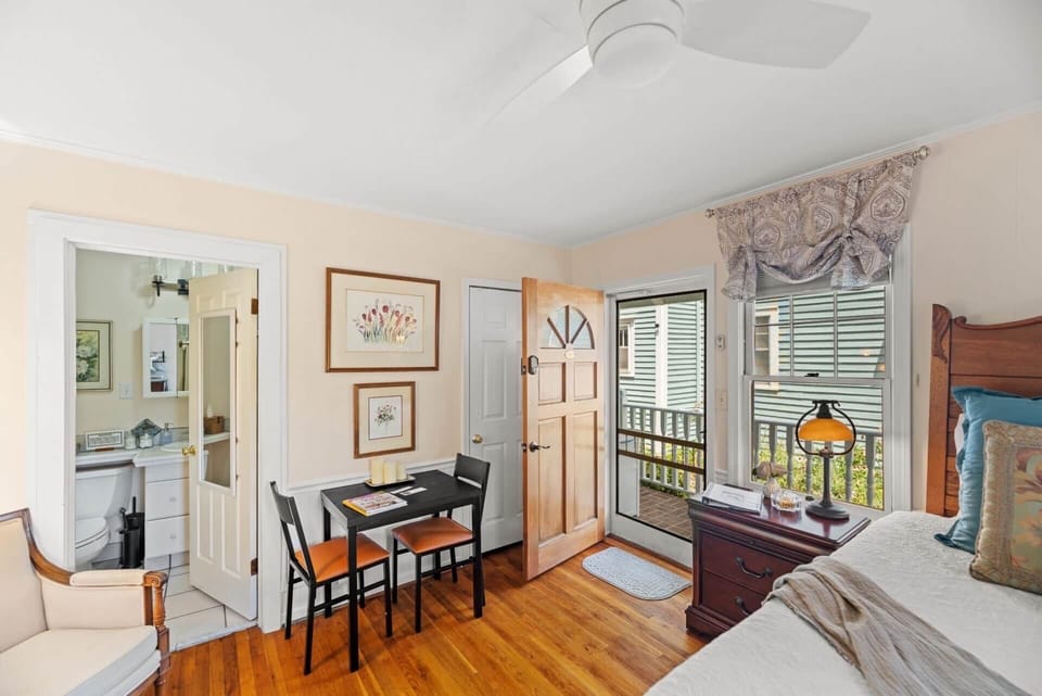 Entrance of studio with small table and chairs  for dining. 